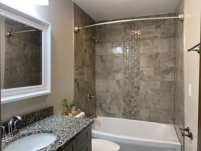 Building Photo - Updated 2BR/1.5BA with garage, lawn care included