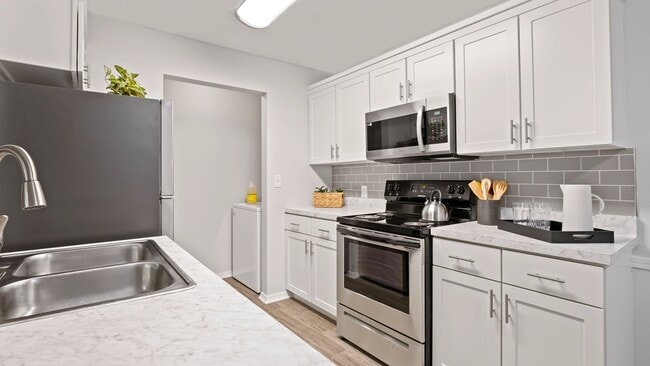 Experience the joy of cooking in our newly renovated kitchens, brimming with ample cabinets and countertop space. It's culinary delight at your fingertips! - The Avenue