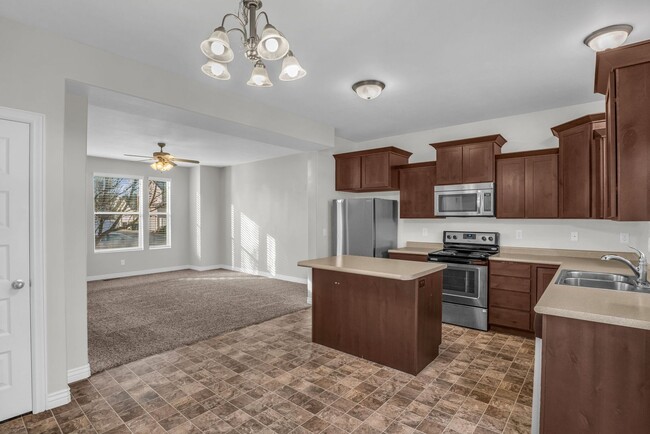 Building Photo - Spacious 4BR End-Unit Townhome | Low-Maintenance HOA Living