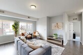 Located at 18248 W 12 Mile Rd in Southfield, Michigan, this two-bedroom, one-bathroom residence offers a well-designed single-floor layout. The open-concept living, dining, and kitchen area serves as the heart of the home, featuring dark hardwood-style flooring, soft neutral gray walls, and large windows that flood the space with natural light while framing views of the surrounding community. The living area provides generous room for comfortable furnishings and flows seamlessly into the dining space.

The kitchen is equipped with stainless steel appliances, including a refrigerator, range, microwave, and dishwasher, complemented by white cabinetry, granite-look countertops, and a deep utility sink — a practical and attractive setup for everyday cooking. A dedicated hallway connects the main living area to the two carpeted bedrooms, each offering plush comfort and bright windows with outdoor views. The spacious primary bedroom features dual windows for exceptional natural light. A well-appointed bathroom includes a tub/shower combination with elegant large-format tile surround. Additional highlights include five closets for ample storage, a dedicated laundry room with a stacked washer and dryer, and a welcoming entrance foyer.