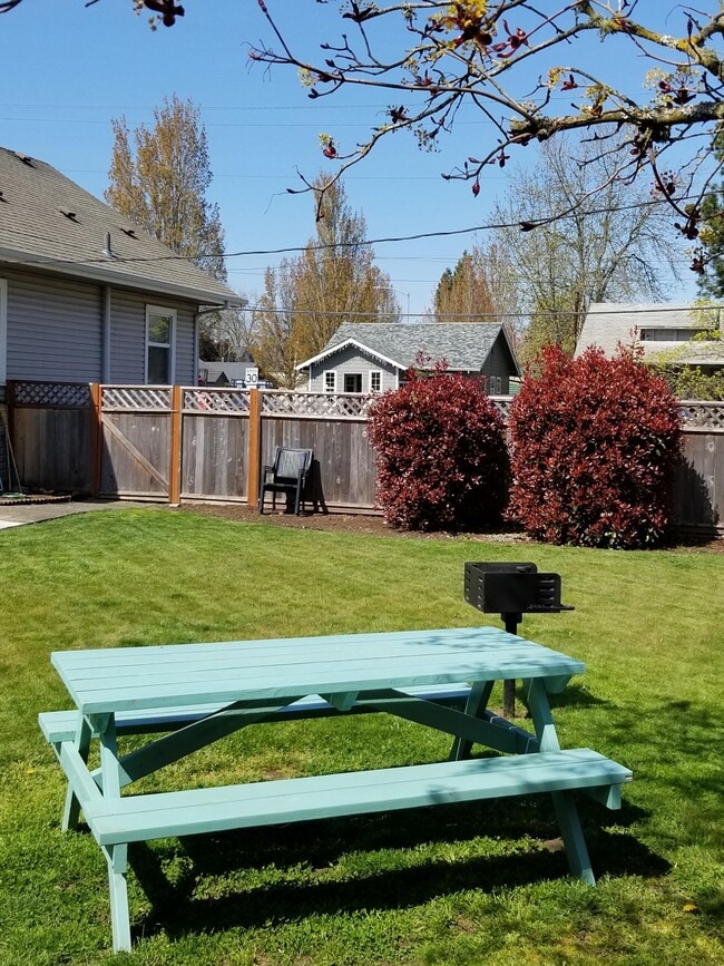 Picnic table in fenced backyard - 360 Columbia St NE