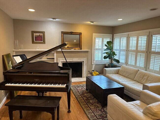 Living room with Grand Piano - 5966 11th Ave