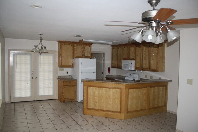 Kitchen with granite countertops, plenty of cupboard space. Pantry. - 1503 West Fig Avenue