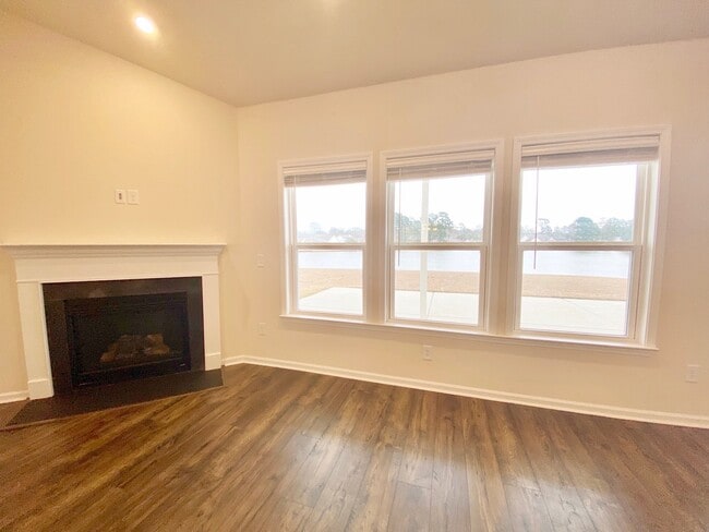 living area with fireplace. Lake views! - 637 Hickman St