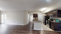 This 1,150 square foot single-story residence in Orlando, Florida offers a well-designed living space with four bedrooms and two bathrooms. The home features a modern kitchen with dark wood cabinetry, granite countertops, and stainless steel appliances, seamlessly connected to an open living area with wood-look flooring. The primary bedroom, measuring 160 square feet, provides ample space and includes a ceiling fan for comfort. Two full bathrooms are equipped with essential fixtures, including a bathtub in at least one. The dedicated laundry room comes with a washer and dryer set. Throughout the home, neutral-toned walls and carpeting in some rooms create a versatile backdrop for various decor styles. Large windows in the bedrooms allow natural light to flood the spaces. The property also features two hallways for easy navigation and two closets for storage. Ceiling fans in multiple rooms and central air conditioning ensure year-round comfort in Orlando's climate. This home's layout and amenities make it well-suited for families or those seeking a comfortable living space with modern conveniences.