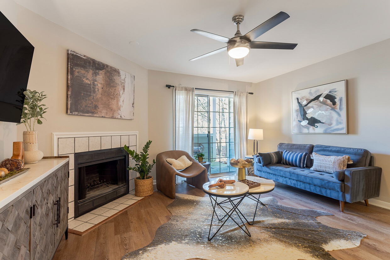 Newly Renovated Living Room with Hardwood-Style Flooring - The Landings of Brentwood Apartments