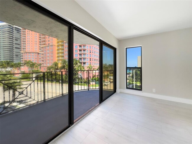 3 / 27Large hurricane sliders connect the balcony and main living area, bringing in natural light th - 2029 N Ocean Blvd