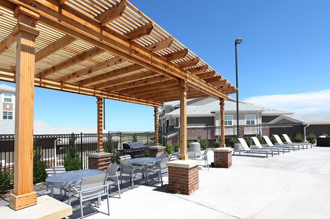Pool and outdoor lounge area at Outlook Blvd. - Outlook Ridge