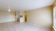 Located at 8655 Pitner Road in Houston, TX, this single-story, 2-bedroom, 1-bathroom home offers a straightforward and efficient layout ideal for comfortable everyday living. Light tile flooring runs throughout the entire home, lending a clean and cohesive look to every room.

The combined living and dining area forms the heart of the home, bathed in natural light from a front-facing window. Warm, neutral yellow-toned walls create a welcoming atmosphere throughout. A peninsula-style breakfast bar connects this open living space to the kitchen, which features white cabinetry, open shelving, a double-basin sink, and white appliances including a refrigerator and dishwasher. A dedicated pantry or utility closet is also found within the kitchen.

A hallway connects the main living areas to the two bedrooms and shared bathroom. The spacious primary bedroom offers generous room to furnish comfortably and includes its own window for natural light. Both bedrooms are served by two well-proportioned closets featuring built-in shelving rods for organized storage. The full bathroom is finished with a tiled shower-tub combination and clean, simple fixtures. The entire layout is efficient, well-connected, and easy to navigate, making this home a functional and comfortable Houston residence.