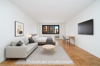 Building Photo - Spacious Midtown East 500+ SF Studio | Full-Service Building | Doorman + Gym