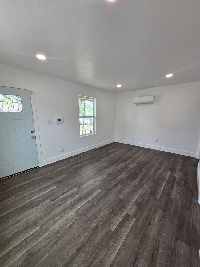 Building Photo - New paint and flooring throughout.