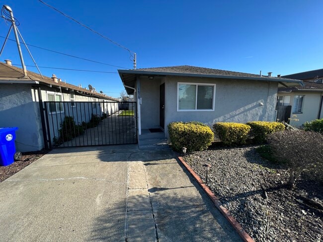 Side yard parking behind gate - 1656 150th Ave