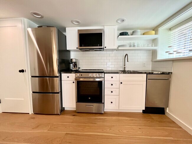 New dishwasher, range, firdge with double bottom freezer, microwave and Breville espresso machine - 7538 Brooklyn Ave NE
