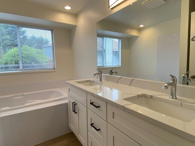 Building Photo - Stylishly Renovated Home with Private Back...