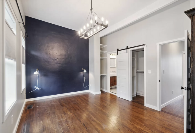 Main bedroom with California closet, and ample space for sitting area to accompany bed. - 829 3rd St NE