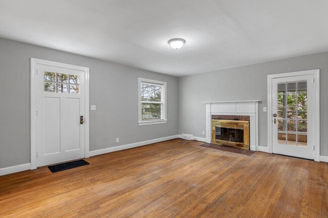 Building Photo - Brick home, Two Story, Hardwoods, 4 Bed Plus 2 Sun Rooms, DR, FP, Carport!.