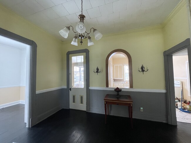 Beautiful wood pass thru to kitchen allows for convenience with formal dining - 438 S Main St