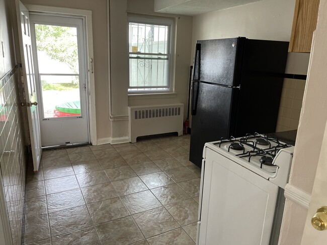 Full kitchen with newly purchased refrigerator - 2719 Fish Ave