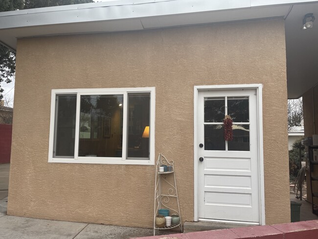 Front door with breezeway between main house - 1316 Arizona St NE