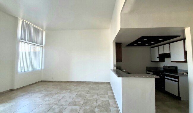 Kitchen and 12 ft hi iving room ceilings - 945 N Serrano Ave