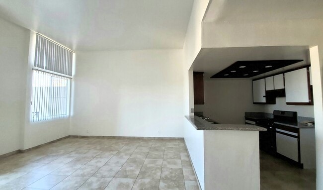 Kitchen and 12 ft hi iving room ceilings - 945 N Serrano Ave