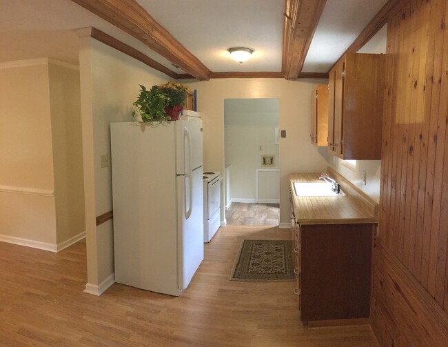 This is a shot from the dining area back to the kitchen area. The galley kitchen is very efficient. All appliances have been replaced, the cabinets refit, and all the flooring replaced. - 2680 Ballsville Road