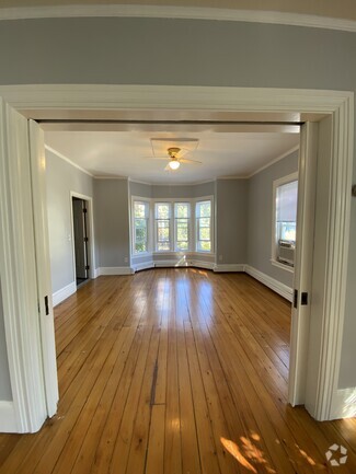 Front parlor/living room with pocket doors open - 86 Holden St