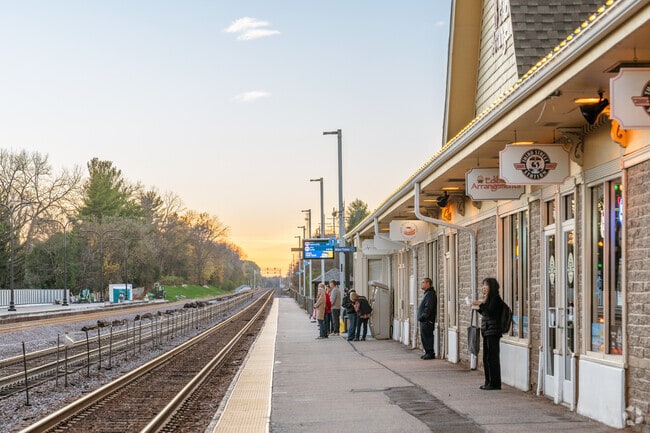 People wait for the Metra at the Geneva station.