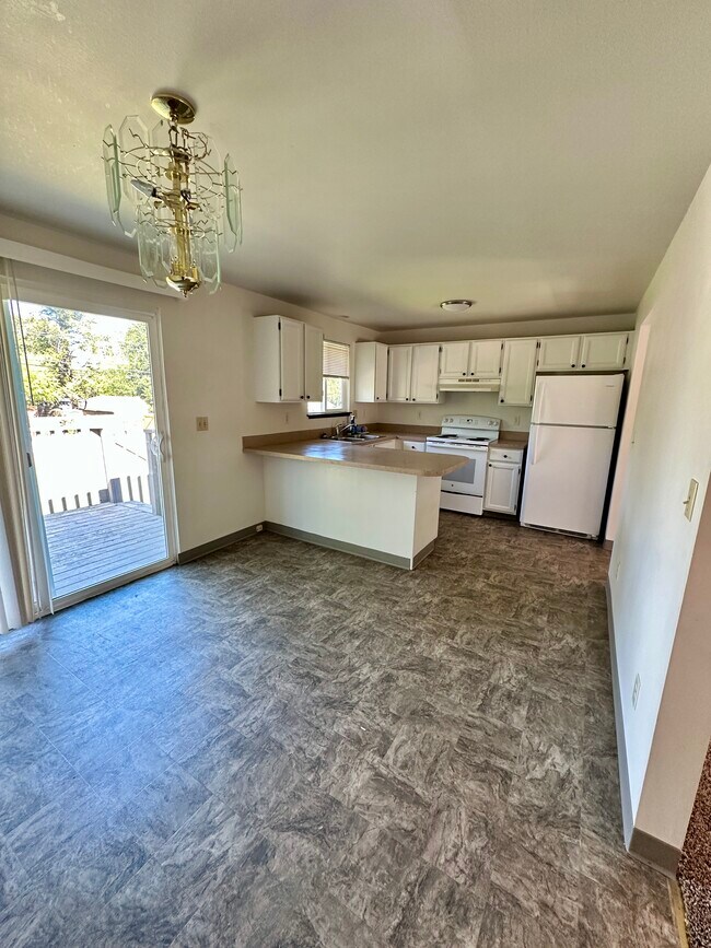 Kitchen with breakfast nook - 13409 E 8th Ave