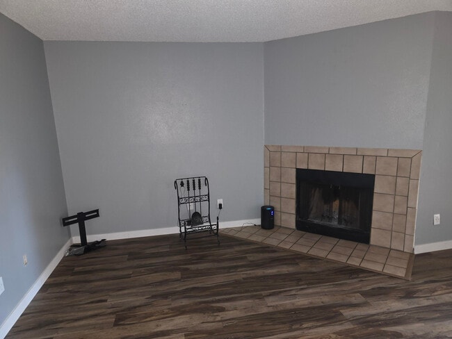 Common area w/Wood burning fireplace - 8910 Fox Dr Apartment