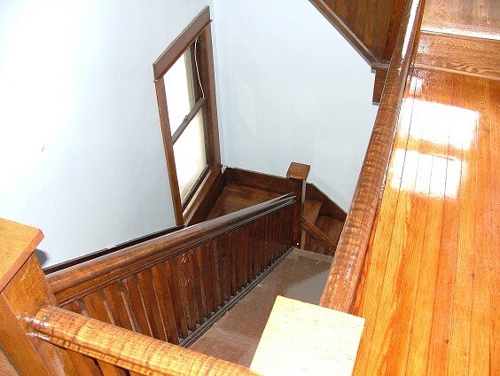 Main staircase into 2nd floor - 817 N Cayuga St