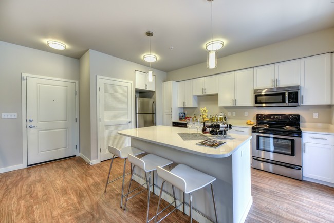 Kitchen with Bar Seating - Madison Bellevue Apartments