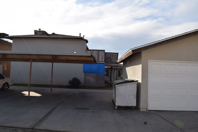Garage and covered parking. - 4124 Parker Ave