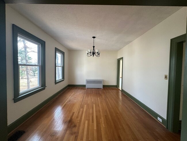 Building Photo - House in Bedford with Lot of Outdoor Space.