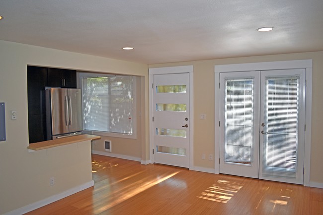 Living Area - Hardwoods, French doors to patio - Bleu Apartments