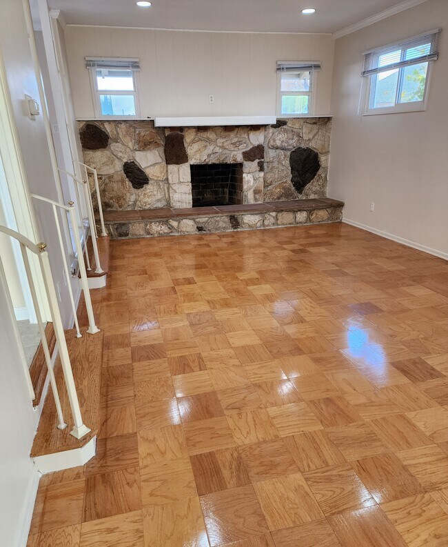 Living Room with resurfaced wood flooring. - 7760 Lurline Ave