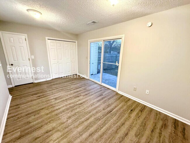 Building Photo - Spacious Townhome with Fenced Yard and Parking Space