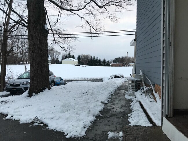 View from your entrance facing sandcreek and your driveway. Fits 2 cars. Your entrance is private. - 31 Sand Creek Rd