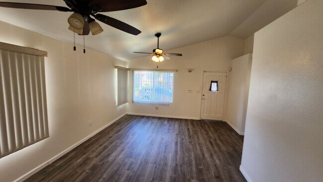 Building Photo - Single Story with large covered patio. Two car garage with uncovered gated parking stall. New vin...