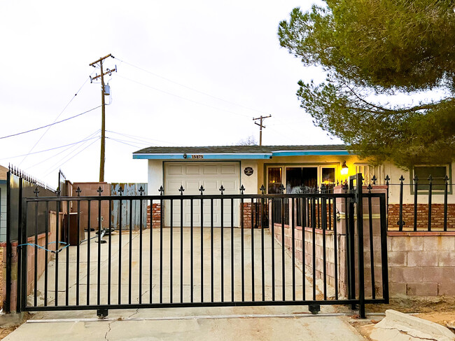 House complete fenced off with privacy screens in place. - 15875 Lawrence Dr