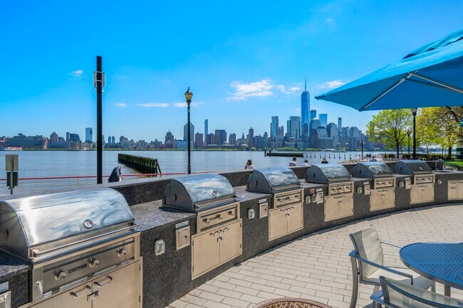 Enjoy poolside relaxation and outdoor grilling with stunning riverview backdrops - Newport Rentals