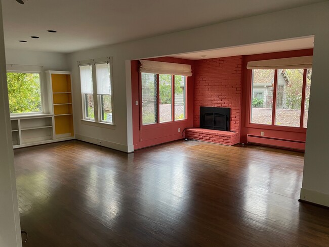 Living room w/gas fireplace, dining area - 2230 Amherst St