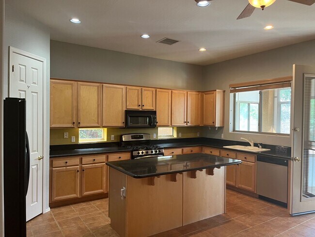 Building Photo - Corner 3 Bedroom Home + 3 Car Garage in Gr...