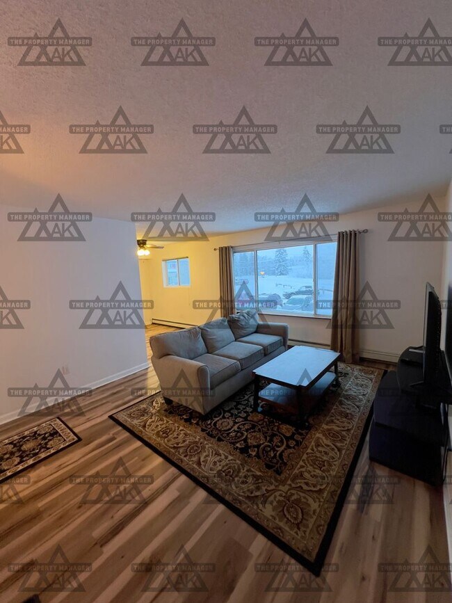 Foto del edificio - Charming Partially Furnished 2-Bedroom Condo for Rent