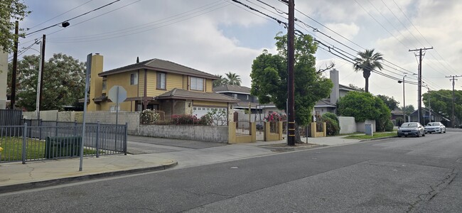Outside of the house, next to children's playground - 151 E 6th St