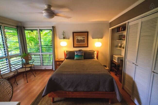A ceiling fan and floor-to-ceiling louver windows to provide excellent cross ventilation - 264 Pouli Rd