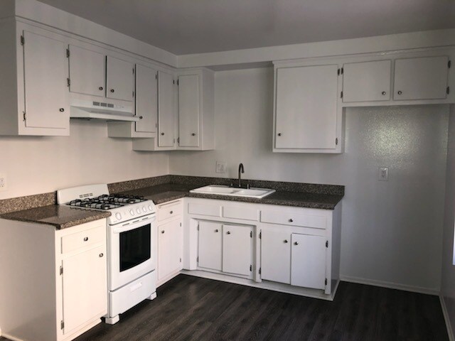 Kitchen with cabinets, stove - 12531 Eucalyptus Ave