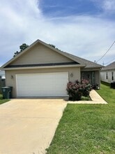 Building Photo - 102C Whispering Pines St