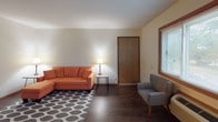 Located at 2606 E Edgerton Ave in Cudahy, Wisconsin, this single-floor unit offers a practical and comfortable layout designed for everyday living. The living room serves as the heart of the space, featuring rich, dark hardwood-style flooring, a large front-facing window that fills the room with natural light, and direct access to the entry door — creating a welcoming and open atmosphere. An adjacent dining area provides additional window views of the surrounding greenery, making the space feel connected to the outdoors. The kitchen is well-appointed with warm oak cabinetry, generous counter space, a double-basin stainless steel sink, and black appliances including a range and dishwasher, offering both style and functionality. The bedrooms are carpeted in a neutral tone and provide generous room dimensions. One bedroom features dual closets offering abundant storage, while another includes a single closet and convenient access to the bathroom. The full bathroom is neatly appointed with a vanity, toilet, and a tub-shower combination. Throughout the unit, baseboard heating ensures consistent warmth, and multiple windows fitted with blinds allow for natural light and privacy. Warm wood-toned trim and doors lend a cohesive, classic character to the overall design.