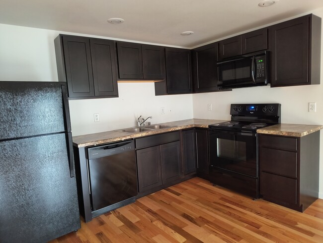 Open concept kitchen/dining/living space. - 515 Main St